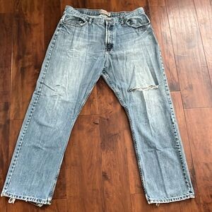 Mens worn in light wash wrangler jeans